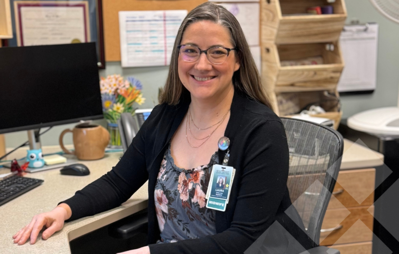 Laura myers at her desk